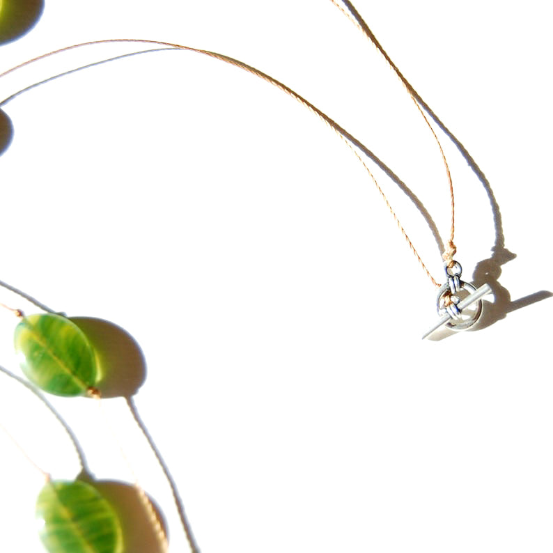 Flat green oval Czech glass bead necklace toggle clasp detail