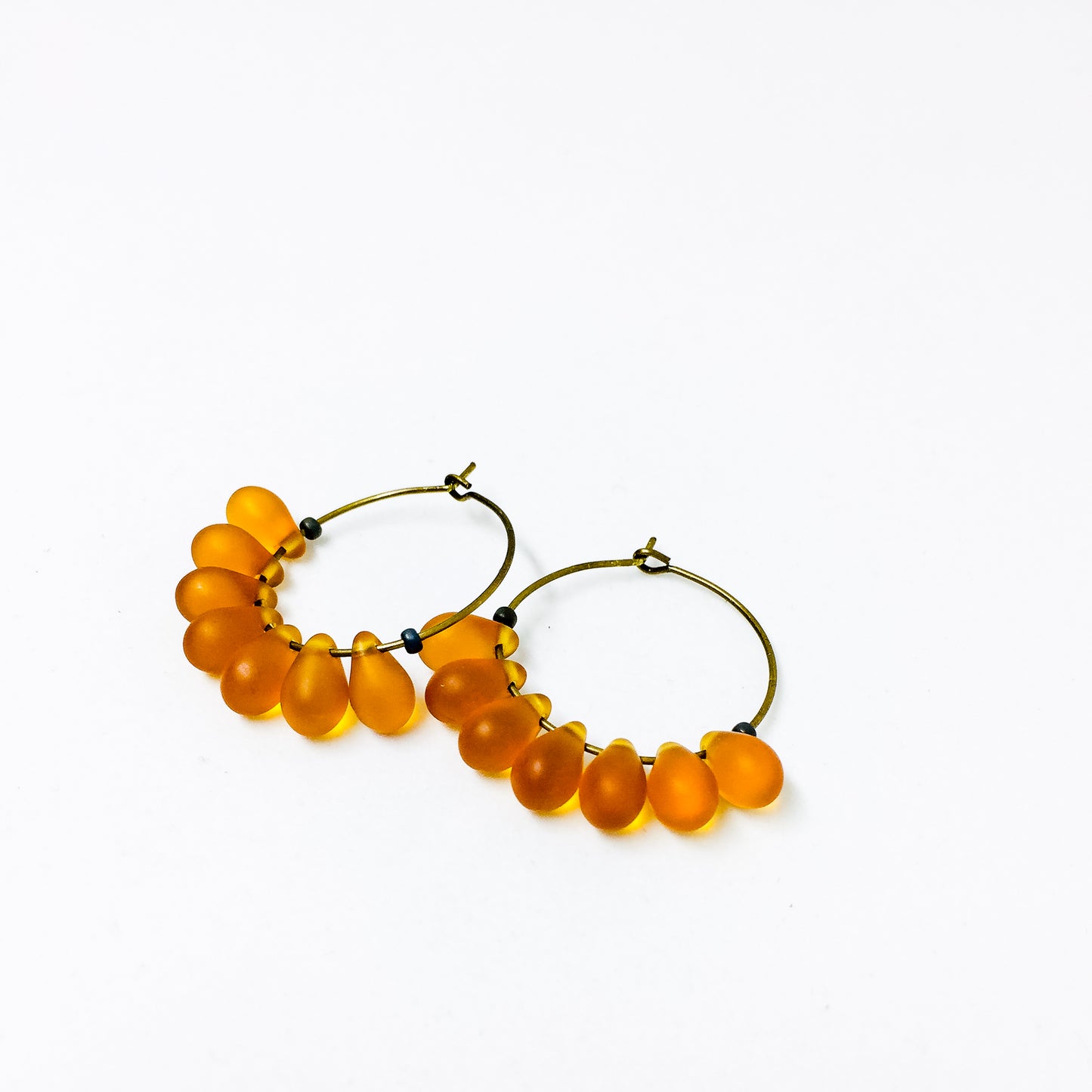 Dewdrop beaded glass hoop earrings in amber